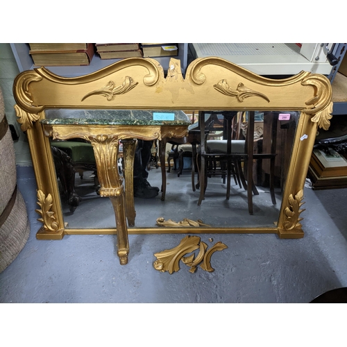 288 - A giltwood framed overmantel mirror with scrolled leaf and C-scroll decoration, rectangular plate gl... 