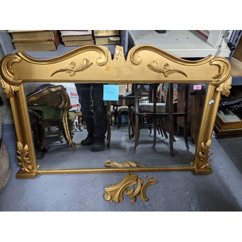 288 - A giltwood framed overmantel mirror with scrolled leaf and C-scroll decoration, rectangular plate gl... 