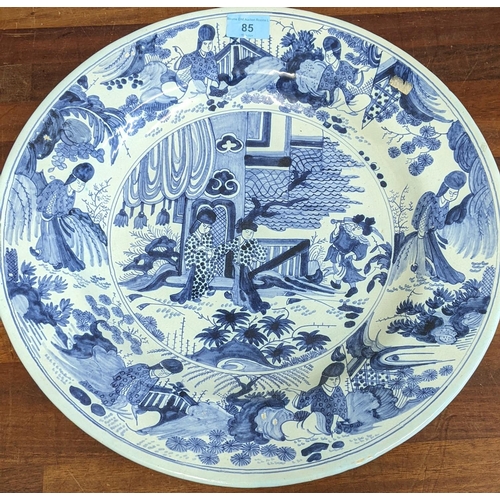 295 - A Delft charger decorated with Oriental scenes in blue and white measuring 41cm Location: RAM
If the... 