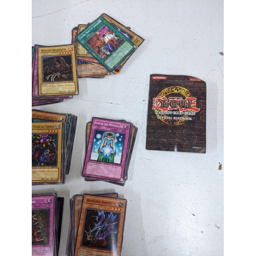 336 - A collection of Yu-Gi-Oh cards, trading card game along with official rulebook
Location: A3F
If ther... 