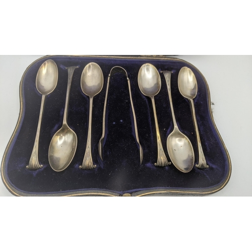 80 - A set of six silver teaspoons, together with a pair of sugar tongs hallmarked London 1906 in a fitte... 