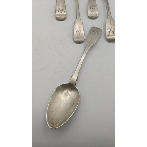 88 - A set of five silver fiddle pattern teaspoons initialled to the terminals, three bearing the same ha... 