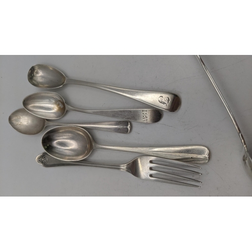 99 - Silver to include a pair of sugar tongs, hallmarked London 1879 together with a fork and a group of ... 