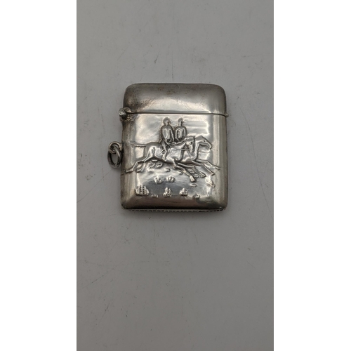 14 - A sterling silver vesta case embossed with horses and figures
Location:
If there is no condition rep... 