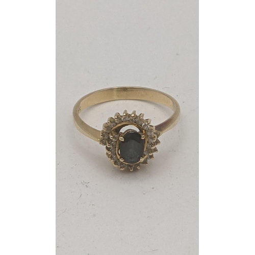 2 - A 14ct gold cluster ring set with a central blue sapphire, surrounded by paste stones, 2.5g, size O
... 