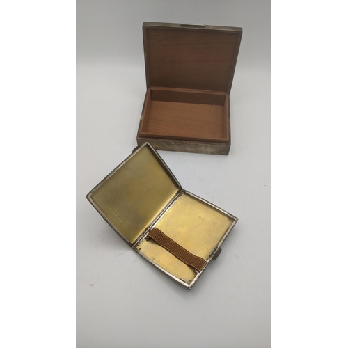 26 - A silver cigarette case with engine turned design having a gilt interior 83.9g, together with a ciga... 