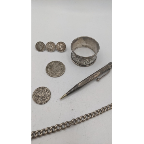 33 - A mixed lot to include a silver pocket watch chain and pendant, along with a napkin ring 44.7g, toge... 