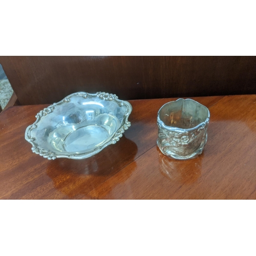 36 - Silver to include floral cast sterling silver napkin ring, along with a floral embossed rim bon bon ... 