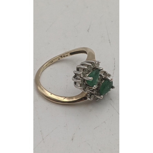 44 - Emerald and diamond pear shaped emeralds surrounded by 24 small brilliant cut diamonds in a 9ct whit... 