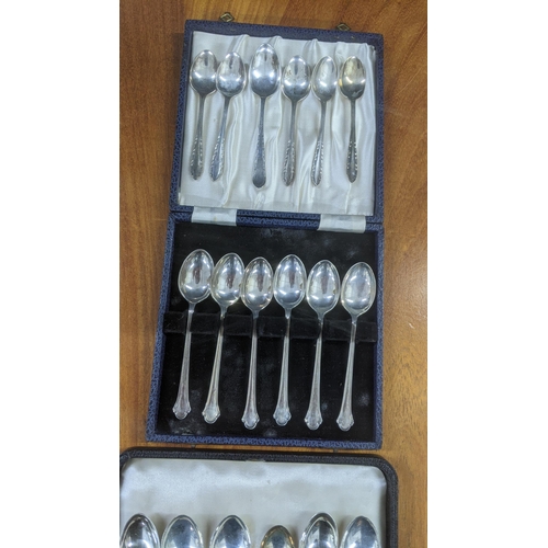 49 - Silver cutlery to include a set of six cake forks, in a fitted case, along with a variety of teaspoo... 