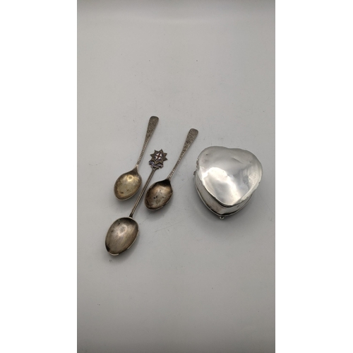 54 - Mixed silver to include a heart shaped pill box on three feet and three silver teaspoons
Location:
I... 