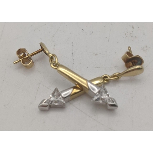 57 - A  pair of 9ct two gold arrow shaped drop stud earrings set with past stones 2.6g
Location
If there ... 