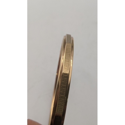 6 - A 9ct gold bangle having a faceted ornate design, 9.7g, 82.7mm in diameter
Location:
If there is no ... 