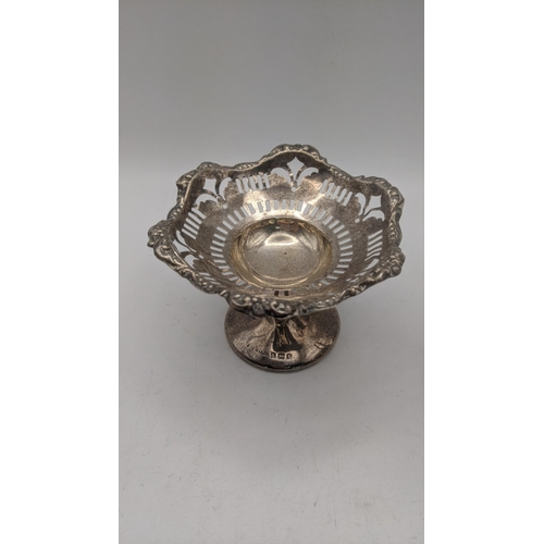 61 - Silver to include two pedestal pin dishes both having a pierced design together with a majestic ster... 