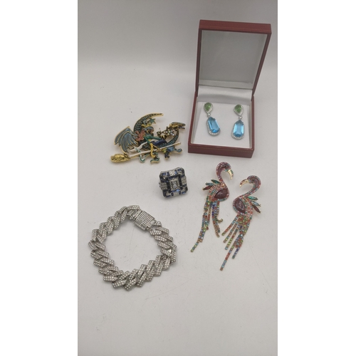 71 - Costume jewellery to include a pair of enamel effect oversized earrings fashioned as flamingo's toge... 