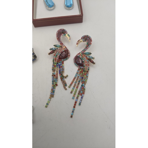 71 - Costume jewellery to include a pair of enamel effect oversized earrings fashioned as flamingo's toge... 