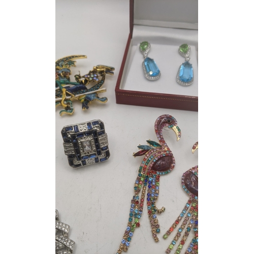 71 - Costume jewellery to include a pair of enamel effect oversized earrings fashioned as flamingo's toge... 