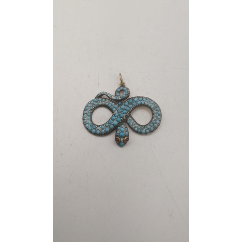 76 - A yellow gold backed and turquoise snake pendant set with a pair of garnets, 54.7mm w x 52.7mm Locat... 