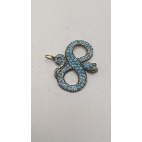 76 - A yellow gold backed and turquoise snake pendant set with a pair of garnets, 54.7mm w x 52.7mm Locat... 