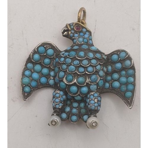 77 - A yellow gold backed turquoise pearl and garnet mourning style pendant fashioned as an eagle spreadi... 