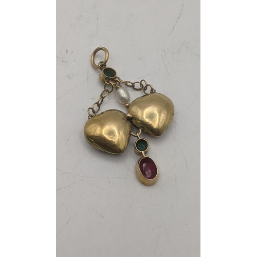 78 - A yellow gold backed double heart pendant set with emeralds, paste stones and rubies and a pearl A/F... 