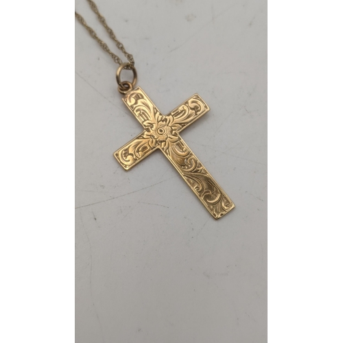 9 - A yellow gold crucifix pendant, tested as 9ct gold, on a 9ct gold necklace
Location:
If there is no ... 