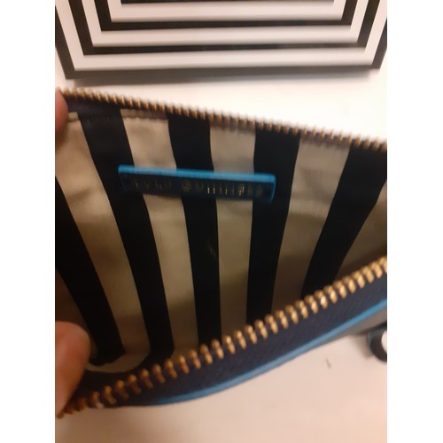 10 - Lulu Guinness-A boxed navy wristlet/clutch bag with turquoise accents and gold tone zipper, un-used,... 