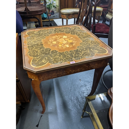 294 - A Sorrento marquetry inlaid games table, with a removeable top and interchangeable gaming boards Loc... 