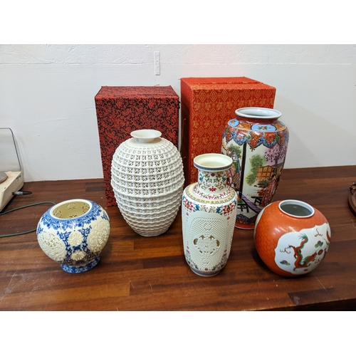 297 - Chinese ceramics to include reticulated cream glazed vase, a coloured vase and a blue and white vase... 