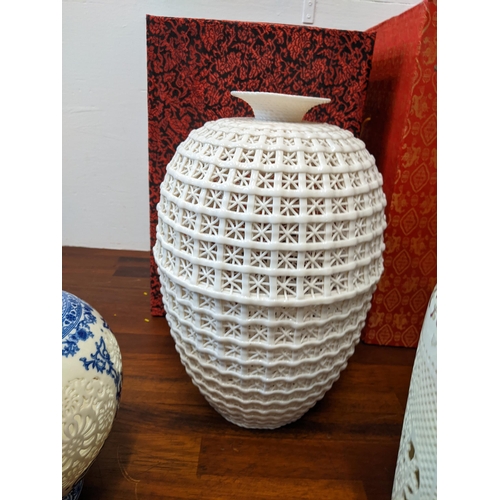 297 - Chinese ceramics to include reticulated cream glazed vase, a coloured vase and a blue and white vase... 