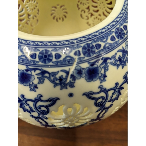 297 - Chinese ceramics to include reticulated cream glazed vase, a coloured vase and a blue and white vase... 