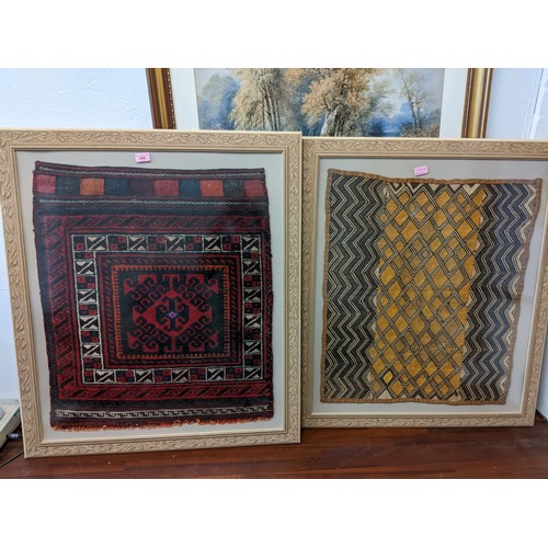 298 - Two Afghanistan rugs, each set in a glazed wood effect frame Location: G
If there is no condition re... 