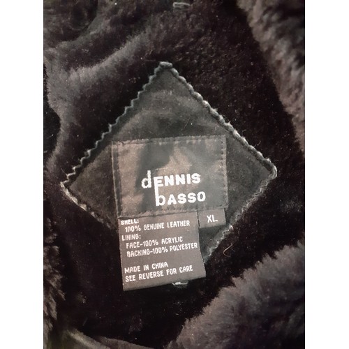 62 - Dennis Basso- Two ladies sheepskin coats comprising a black example (2 front buttons missing) size X... 