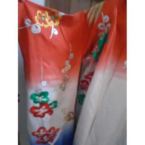 45 - A Japanese heavily embroidered Uchikake/wedding kimono robe in colourful blues, reds, green and gold... 