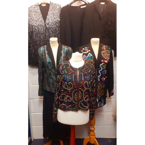 48 - A quantity of ladies black evening wear to include a Diane Fres black knitted cardigan with embellis... 