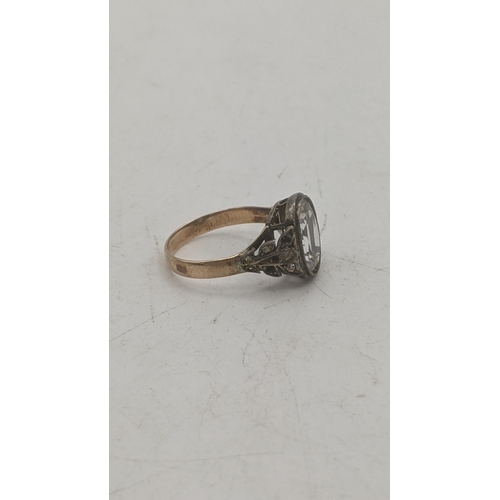 197 - A Victorian oval faceted cut rock crystal, set in silver with a yellow gold shank tested as 9ct, set... 