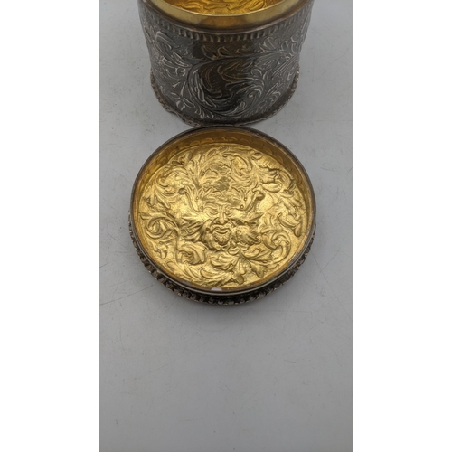 198 - A silver floral embossed dressing table lidded pot having a gilt interior, hallmarked London 1885, 1... 