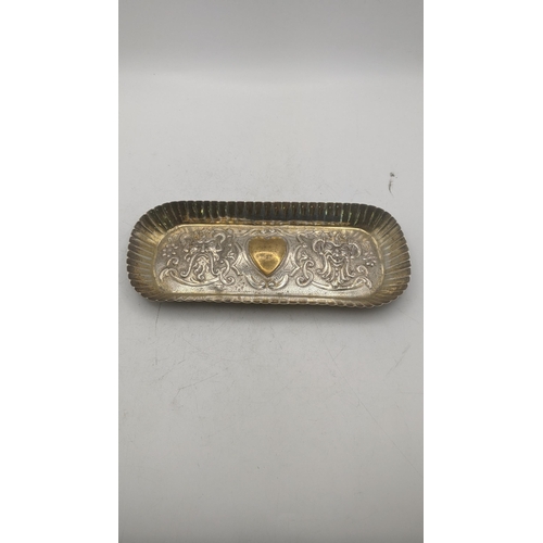 199 - Silver dressing table items to include a rectangular form with embossed decoration depicting a centr... 