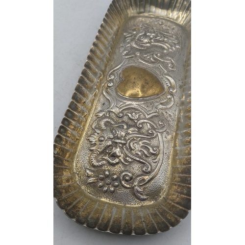 199 - Silver dressing table items to include a rectangular form with embossed decoration depicting a centr... 