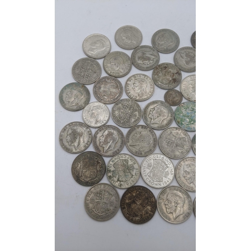 201 - A collection of 1920s/1946 silver British coinage to include half crowns, and others, total weight 5... 