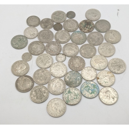 202 - A collection of 1920s/1946 silver British coinage to include half crowns and others, total weight 50... 