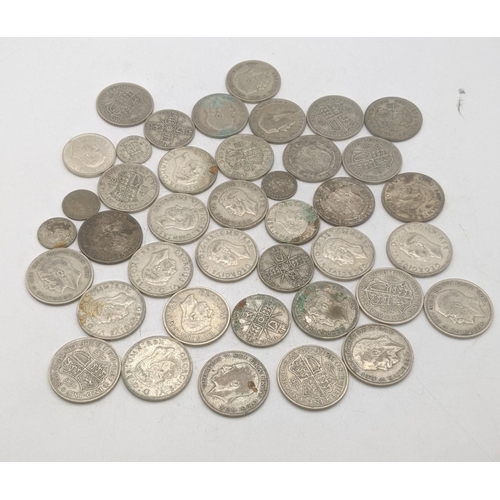 204 - A collection of 1920s/1946 silver British coinage to include two shillings and others, total weight ... 