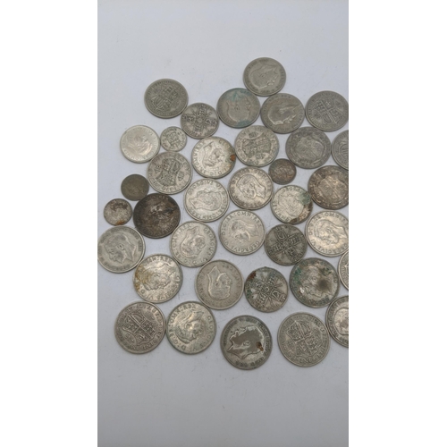 204 - A collection of 1920s/1946 silver British coinage to include two shillings and others, total weight ... 