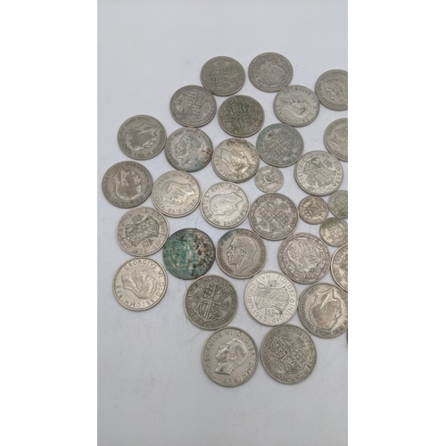 205 - A collection of 1920s/1946 silver British coinage to include sixpences, and half crowns, total weigh... 