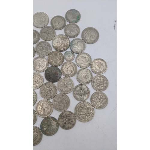 208 - A collection of 1920s/1946 silver British coinage to include half crowns and others, total weight 51... 