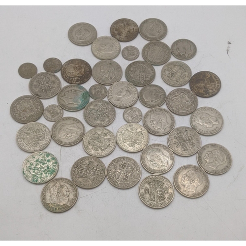 209 - A collection of 1920s/1946 silver British coinage to include half crowns and others, total weight 47... 