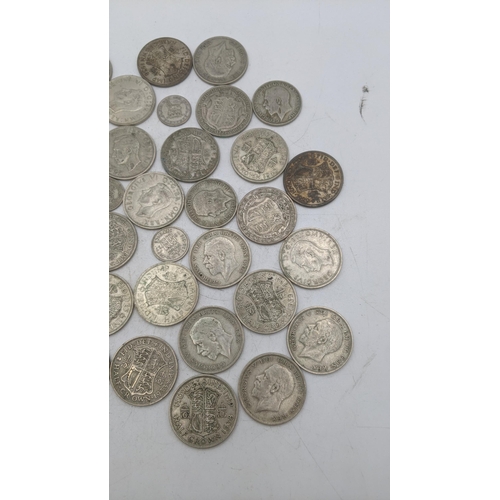 209 - A collection of 1920s/1946 silver British coinage to include half crowns and others, total weight 47... 