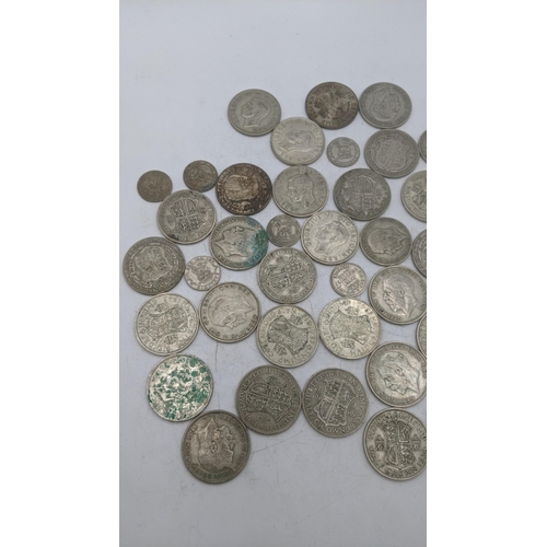 209 - A collection of 1920s/1946 silver British coinage to include half crowns and others, total weight 47... 