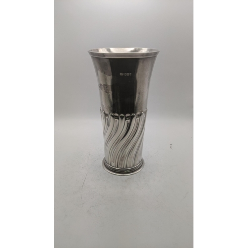 210 - An Atkins Brothers silver tumbler vase with wrythen decoration to the lower half hallmarked Sheffiel... 