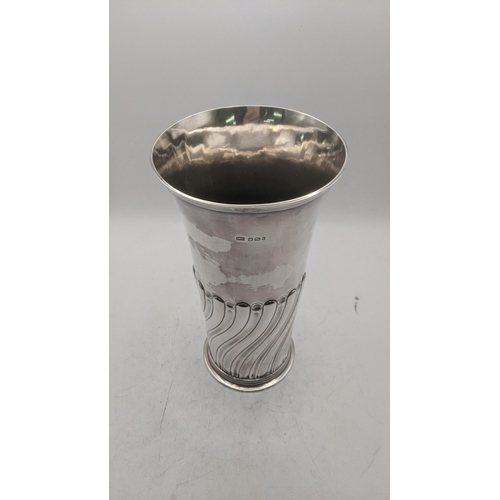 210 - An Atkins Brothers silver tumbler vase with wrythen decoration to the lower half hallmarked Sheffiel... 